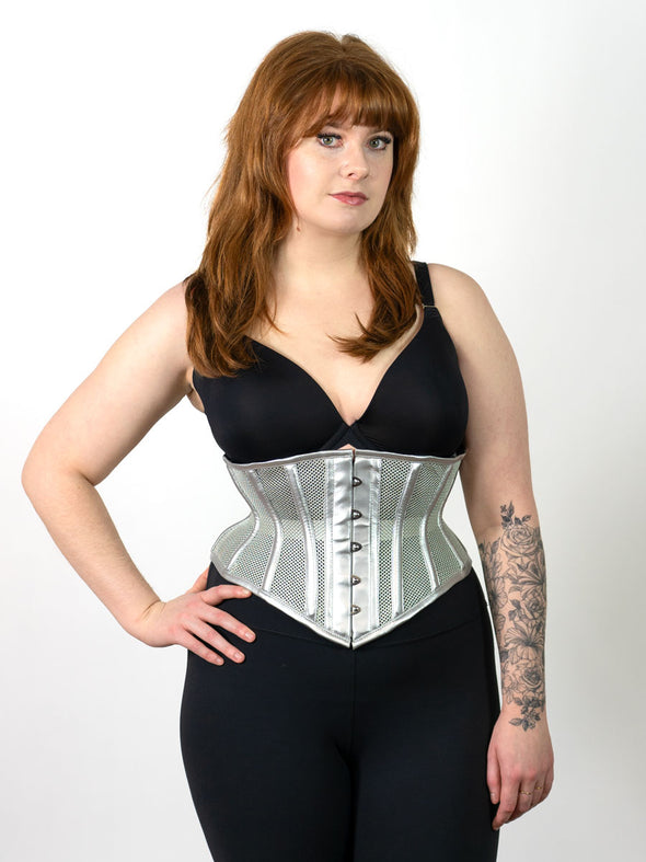 cute corset model wearing a metallic silver mesh waist training fashion corset