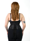 Back lace up corset view of product shot of a model wearing the cs220 orchard corset in black sport mesh with black leggings and a black bra