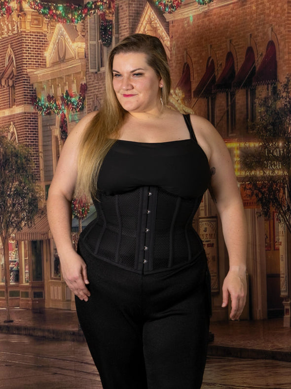 cute curvy plus size corset model wearing the cs345 waist training black mesh corset