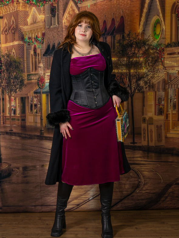 cute corset model holiday  shopping wearing the cs345 black satin waist training corset with a dark fuchsia velvet dress 