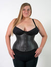 plus size black leather corset worn by a model wearing a CS345 romantic curve waist training corset with a black bra and black leggings