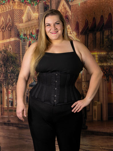 cute plus size corset model wearing the cs411 longline black mesh waist training corset