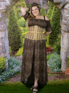 cute curvy Model in an english garden wearing a plus size beige mesh corset with an animal print dress