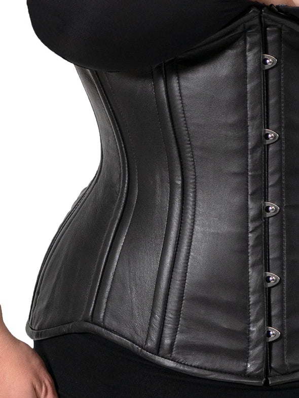 close up detail view of a plus size black corset on a model wearing the cs426 longline hourglass curve waist training corset with a black bra and leggings