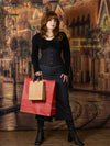 red haired model doing holiday shopping wearing a black cotton waist training corset with hip ties over a black shirt and skirt cs426 standard