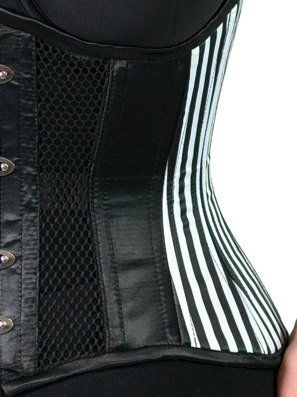 close up detail view of the beetlejuice glam corset costume featuring the 426 standard waist training corset with black and white striped satin and mesh body