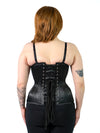 back lace up corset view of a cute model wearing the cs479 longline extreme curve black satin waist training corset with leggings and a black bra